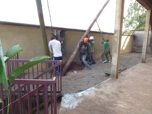 Setting the new pole next to the old one.