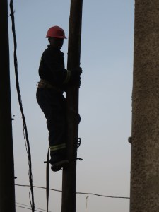 Changing the wires from the old pole to the new one.